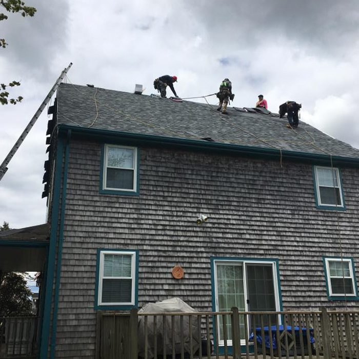 roofers-repairing-a-new-roof-near-warren-ri.jpg